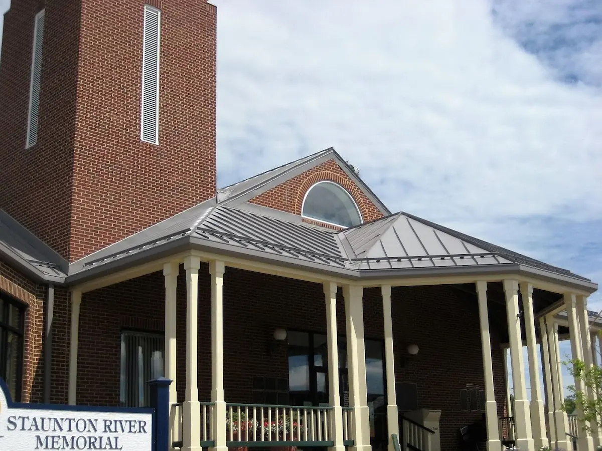 Skilled roofing craftsmen working on a residential roof in Marlborough